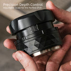 Side view of adjustable depth scale on black coffee tamper.