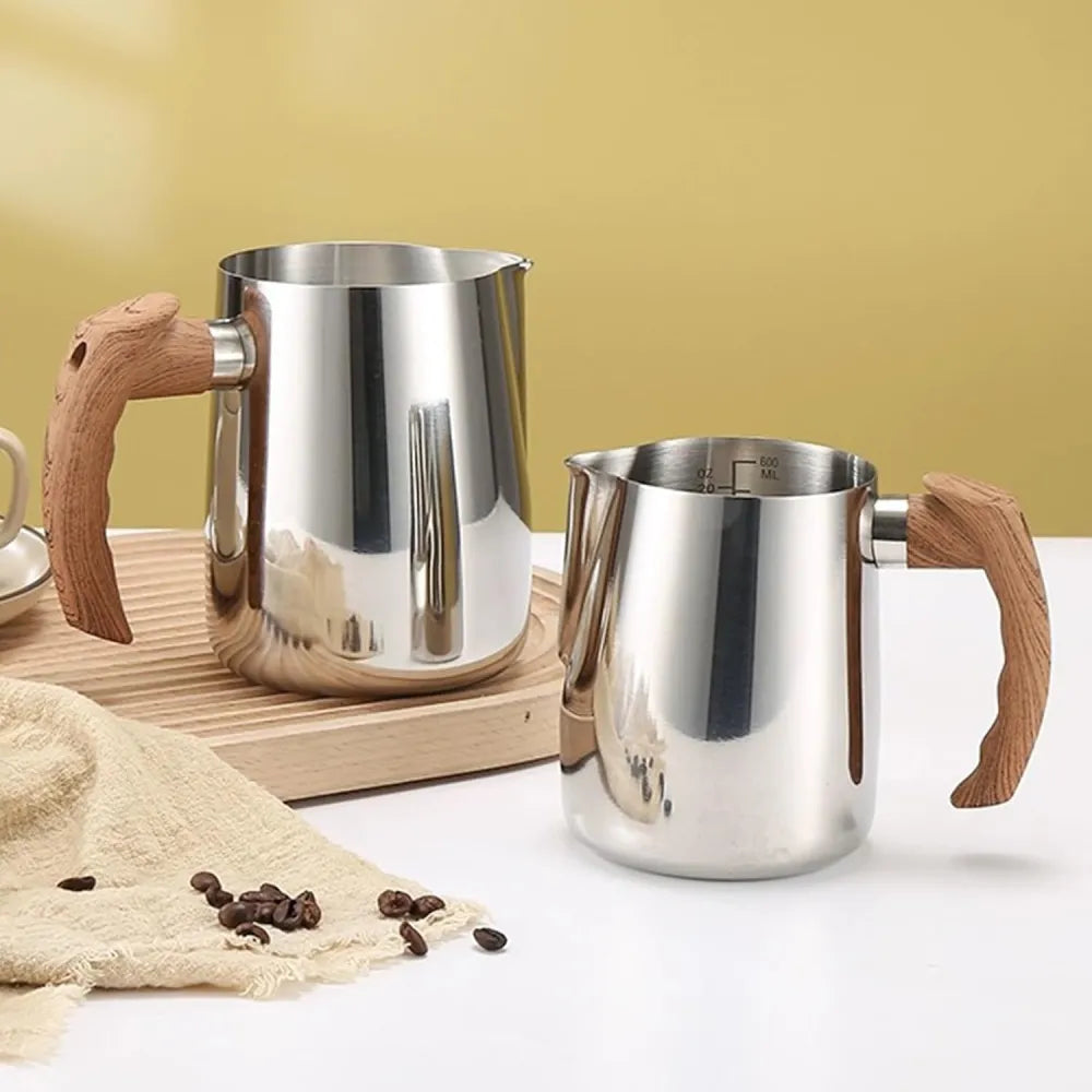 Premium 304 stainless steel 20oz milk frothing pitcher on wooden board.