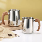 Premium 304 stainless steel 20oz milk frothing pitcher on wooden board.
