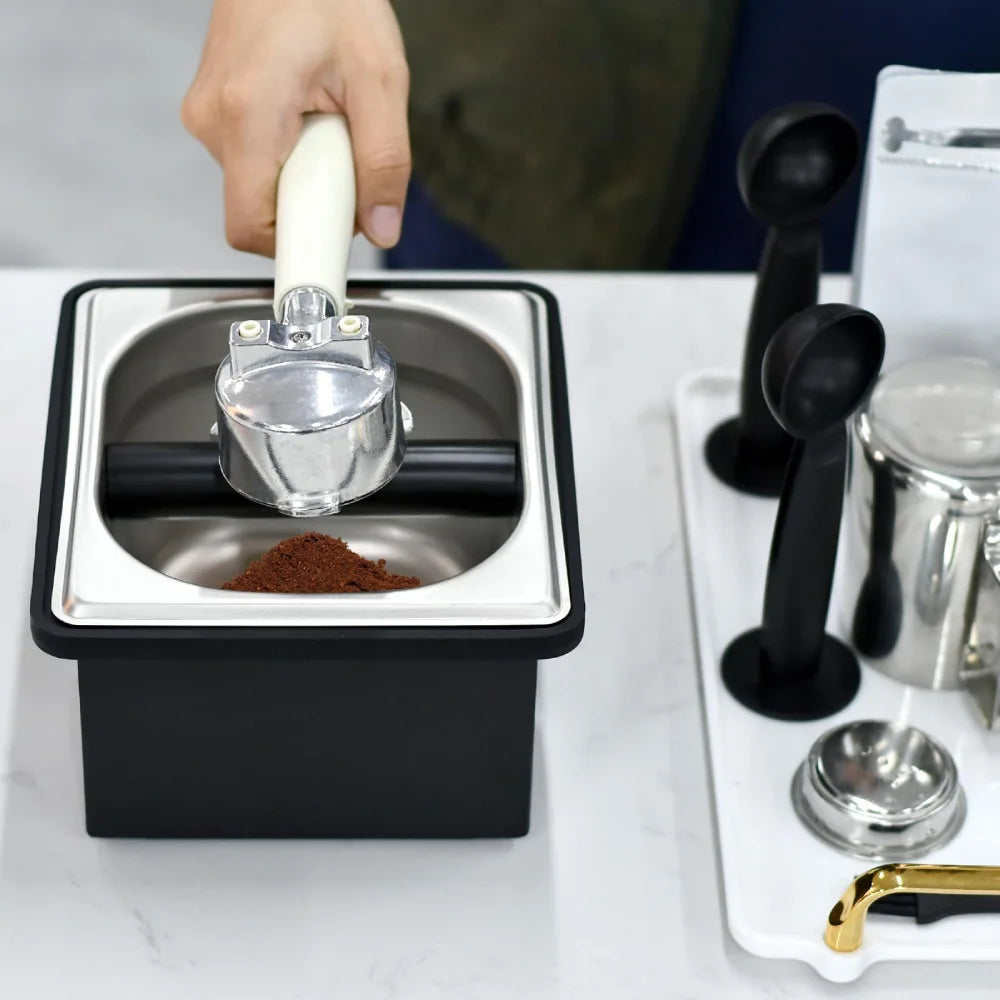 Bottom view of the small coffee ground dump bin showcasing the full-coverage black anti-slip rubber cushion foundation edge.
