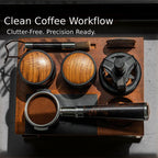 Barista using WDT tool beside espresso workflow station with knock box drawer
