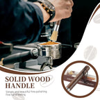 Barista using solid wood handle brush to clean coffee grounds from a 58mm portafilter.