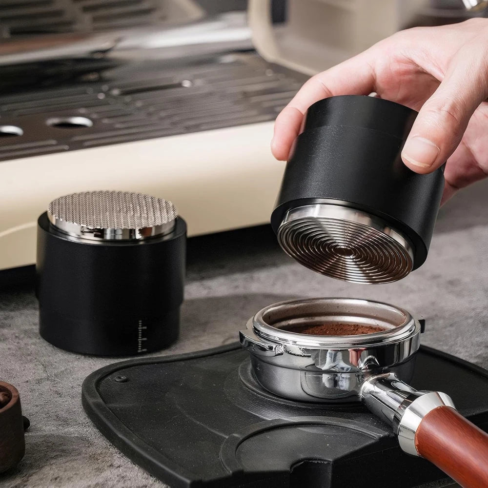 Barista taking apart modular 3-in-1 espresso distribution tool and tamper.