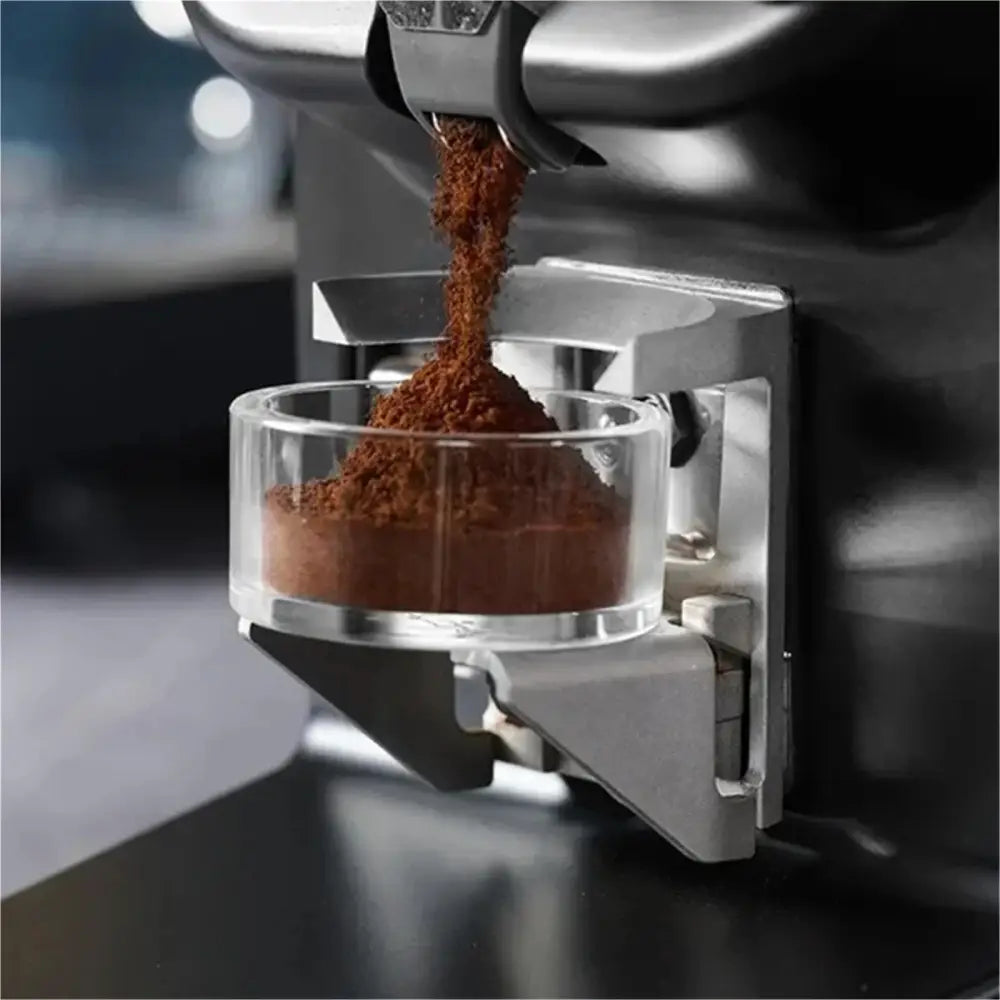 Clear espresso puck prep practice cup collecting freshly ground coffee