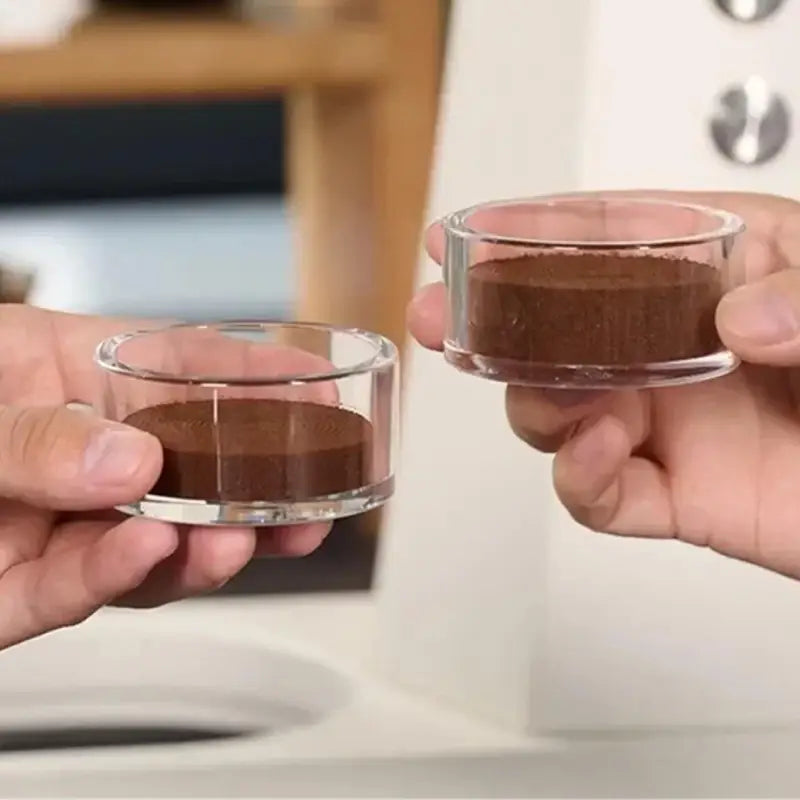 Clear espresso cup showing coffee bed preparation comparison