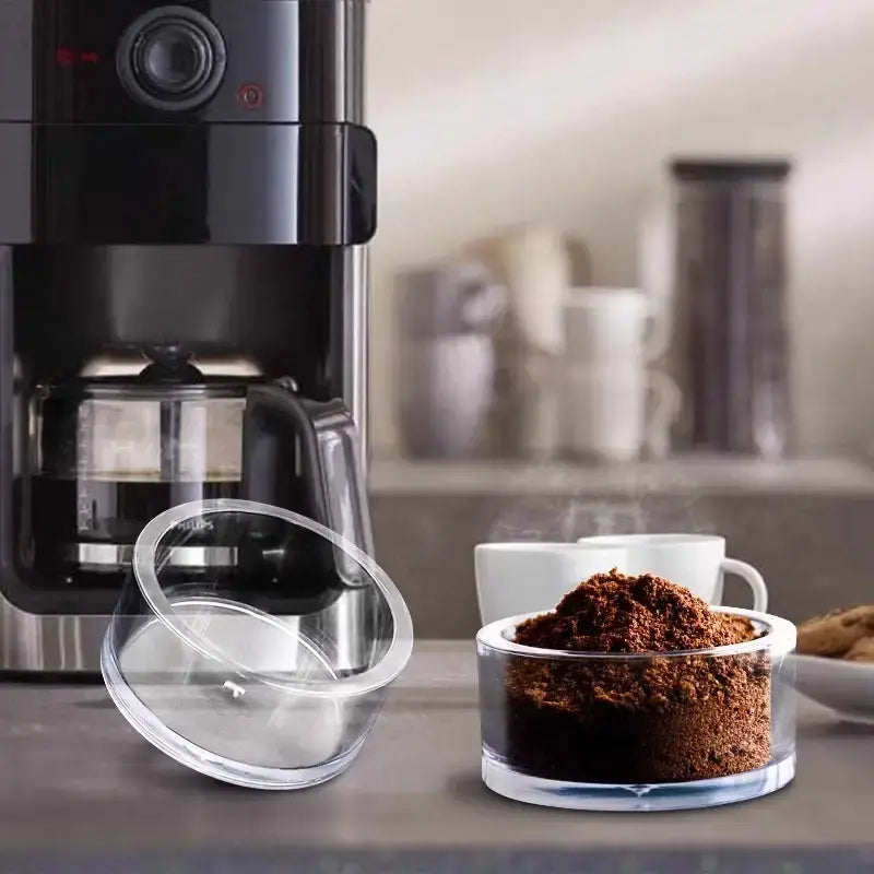 Clear espresso puck prep cup used with home espresso workflow