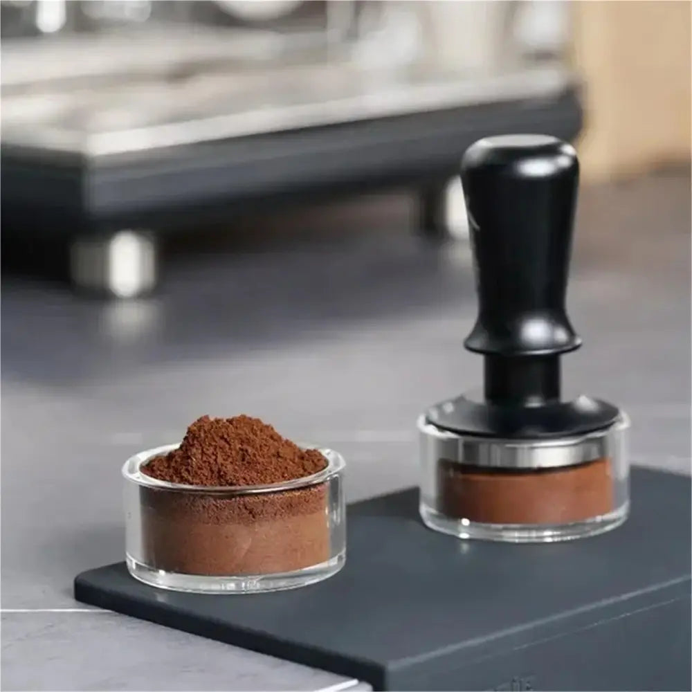 Practicing espresso tamping with clear puck preparation cup