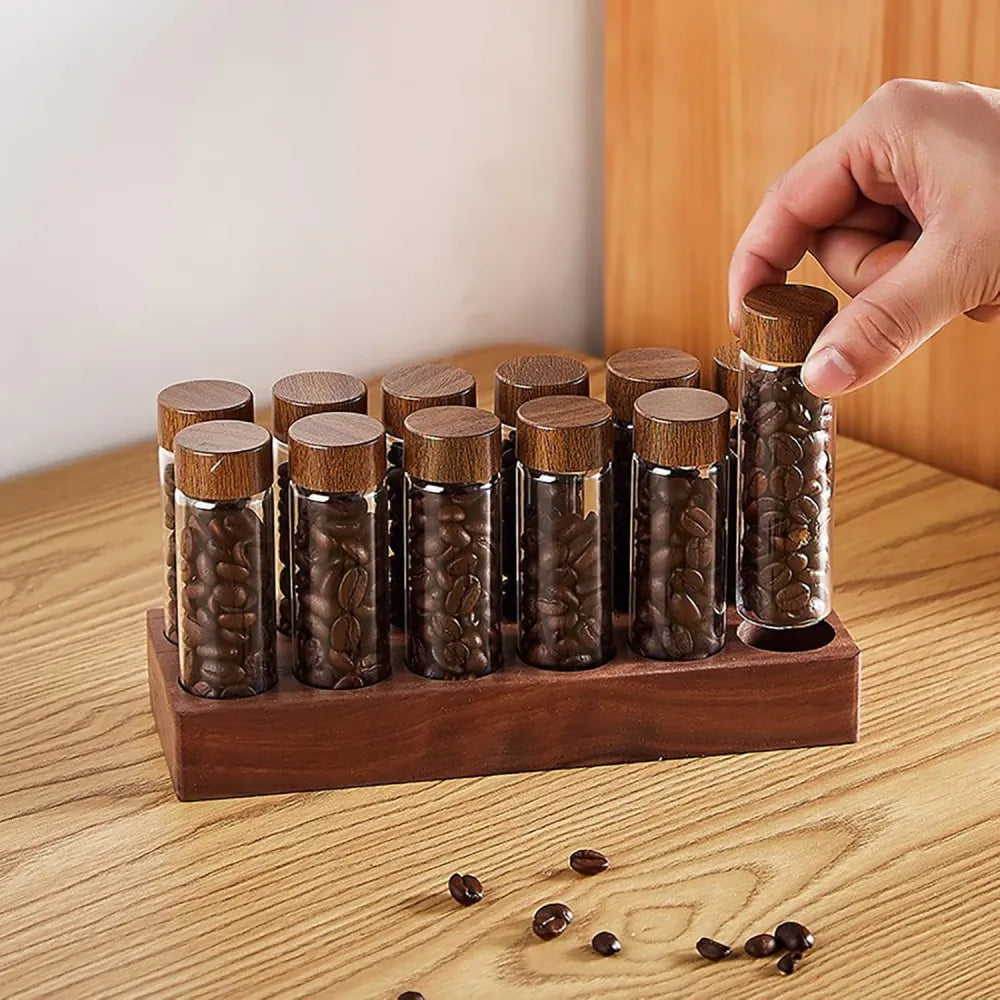 14-piece single dose coffee bean storage tubes with solid walnut wood stand.