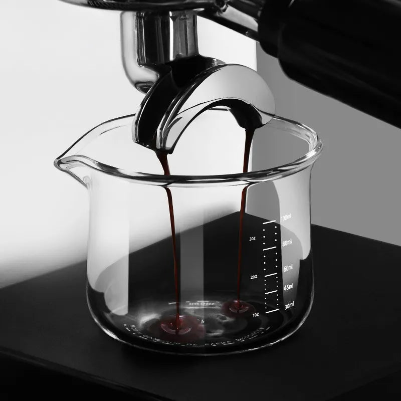Culturbo handle-free espresso shot glass with a single precision spout and clear measurement scales