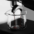 Culturbo handle-free espresso shot glass with a single precision spout and clear measurement scales