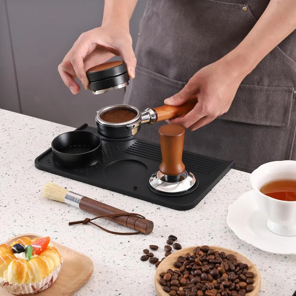 Barista using heavy duty silicone tamping mat for stable espresso puck prep.
