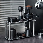 Double-tier acrylic espresso tool organizer next to an espresso machine