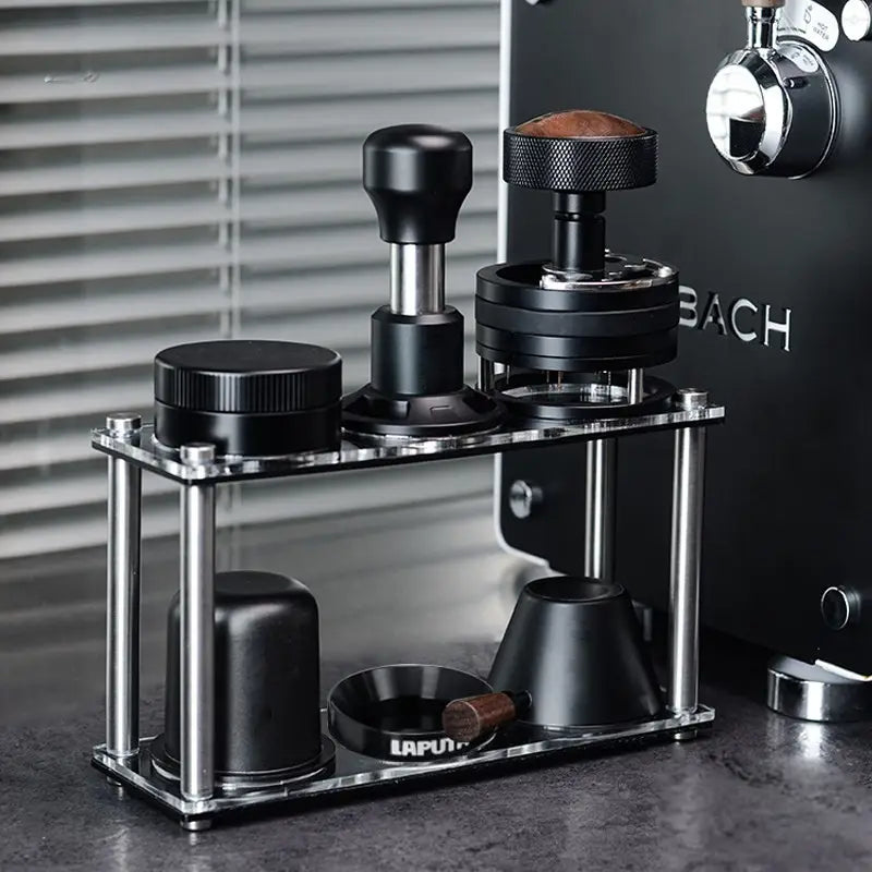 Double-tier acrylic espresso tool organizer next to an espresso machine