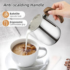Barista pouring milk from frothing pitcher with ergonomic anti-scalding bakelite wood grain handle.
