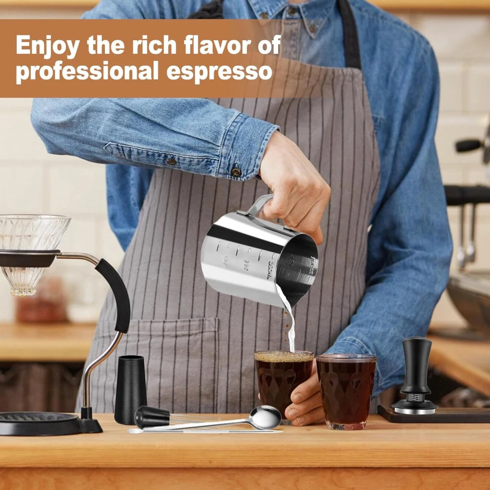 Barista pouring steamed milk from 350ml stainless steel pitcher for latte art.