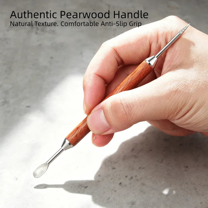 Ergonomic natural pearwood handle of espresso decorating tool.