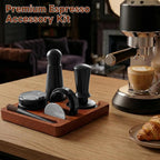 Premium black espresso tools set neatly organized on solid wood tamping station next to coffee machine.