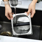 Hands holding the empty stainless steel container shell and rinsing the interior under a running water faucet for easy cleanup.